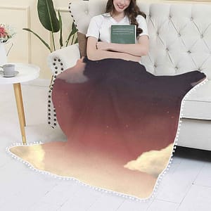 nyt sky pom pom fringe blanket.model